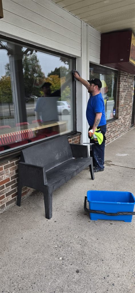 Fundy Blue cleaning a large storefront window